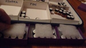 The cut-out piece is placed on top of the bottles to cushion them during shipment.