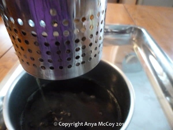 Here is a shot of the alcohol draining from the press into the bowl.